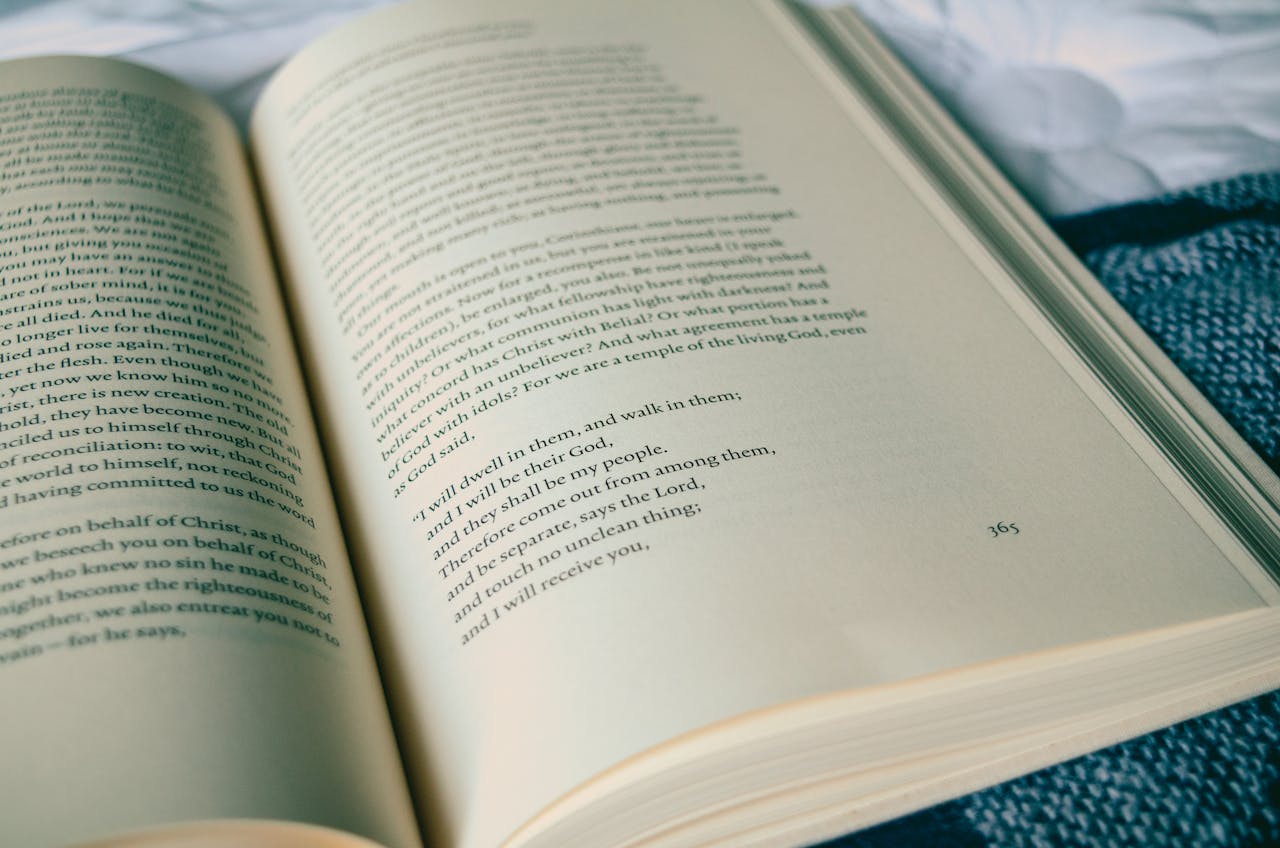 Close-up of an open book with visible text, set against a cozy background, perfect for education themes.